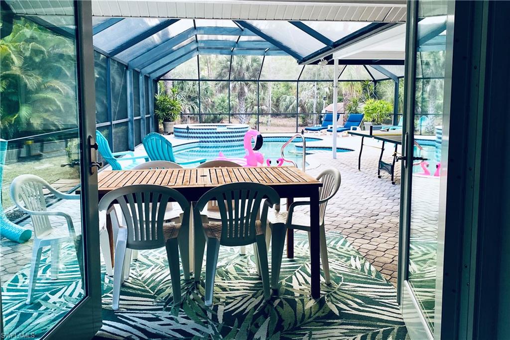3221 64th Street Southwest Naples, FL 34105 - Photo 4 of 12 View of patio with a pool with spa and a lanai