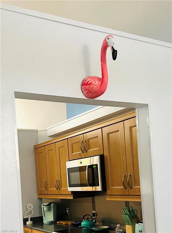 3221 64th Street Southwest Naples, FL 34105 - Photo 6 of 12 Newer appliances, solid wood cabinetry, granite countertops