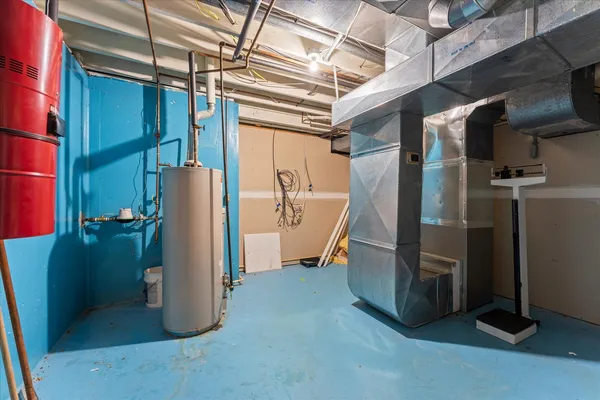 a utility room with refrigerator and washer