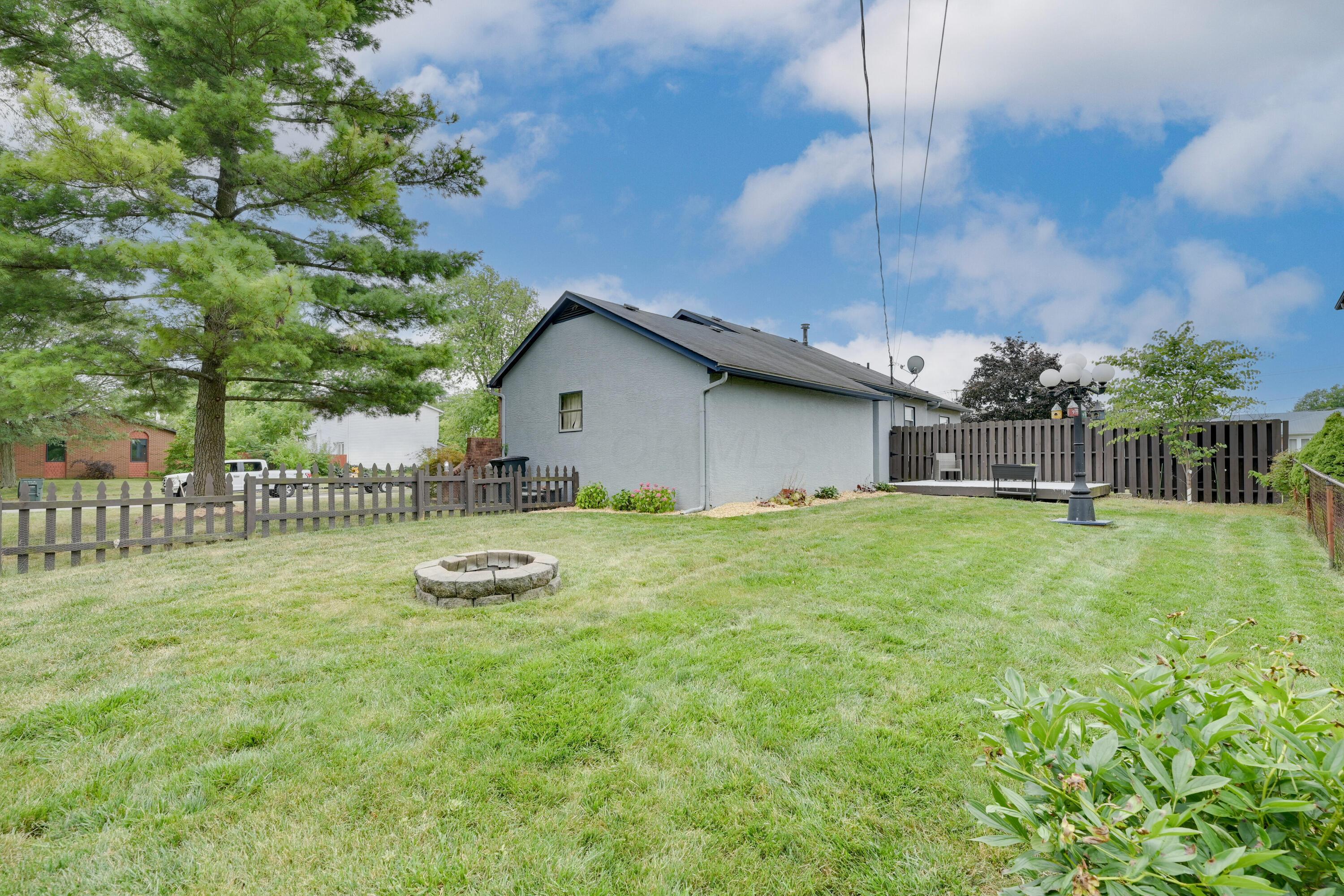 5383 Pine Bluff Road Columbus, OH 43229 - Photo 28 of 32 Fenced backyard with firepit