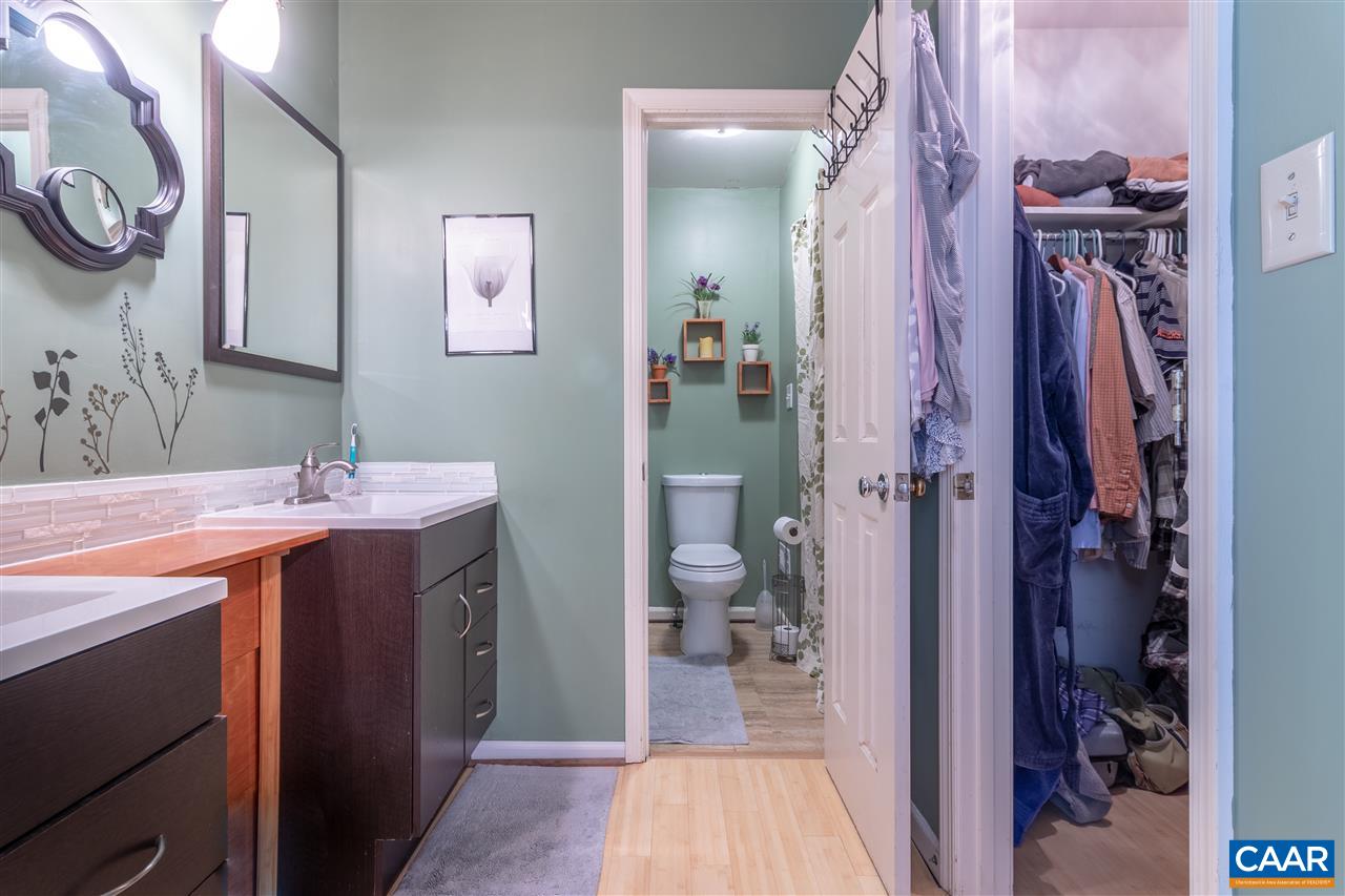 575 Gillums Ridge Road Charlottesville, VA 22903 - Photo 18 of 27 a bathroom with a sink a toilet and a mirror