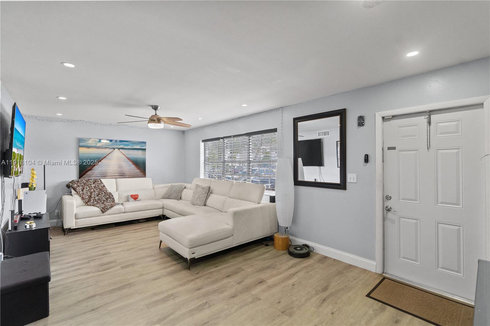 a bed room with furniture and a wooden floor