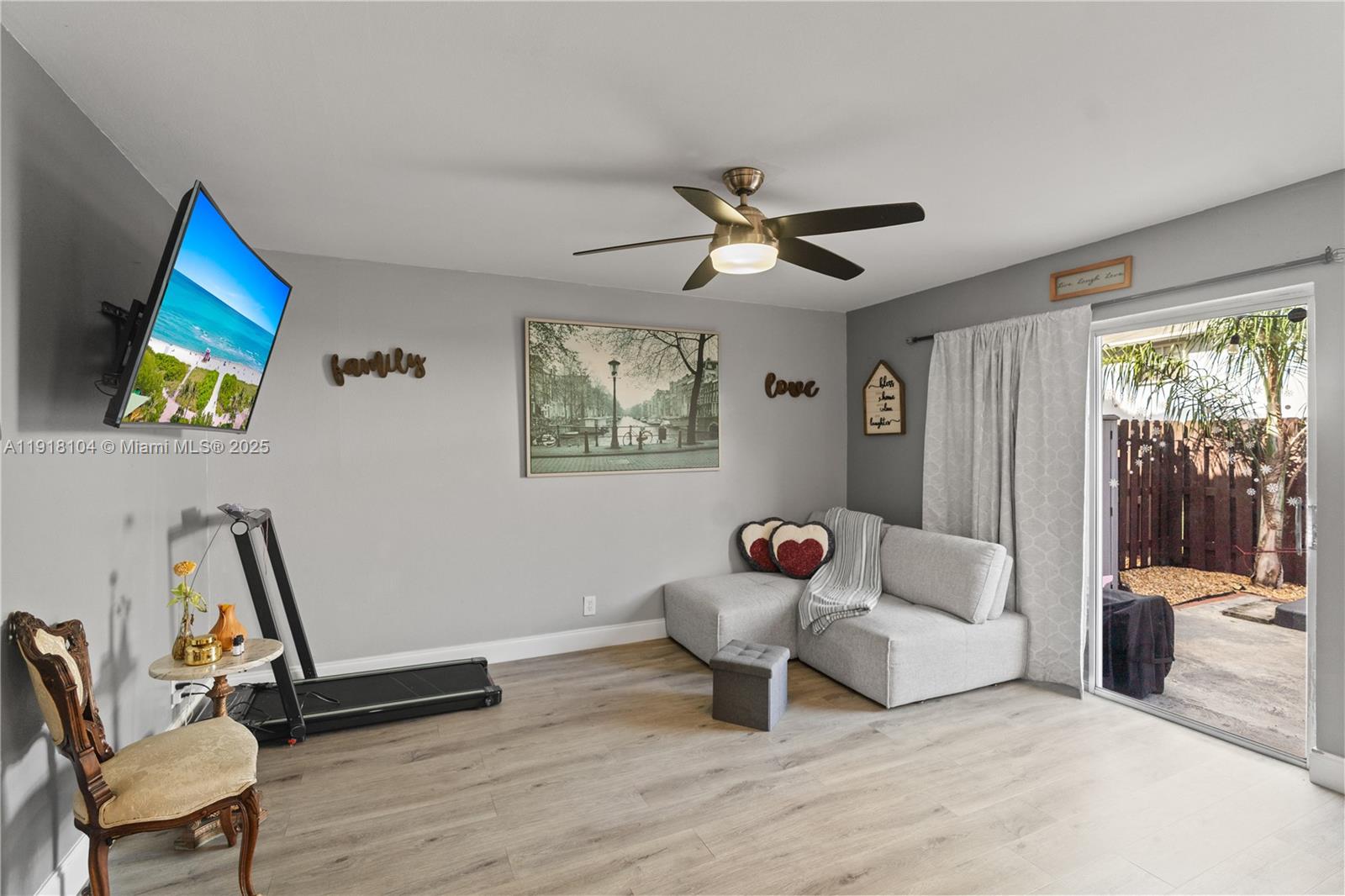 8089 Southwest 18th Court, Unit 27 Davie, FL 33324 - Photo 12 of 36 a living room with furniture and a large window