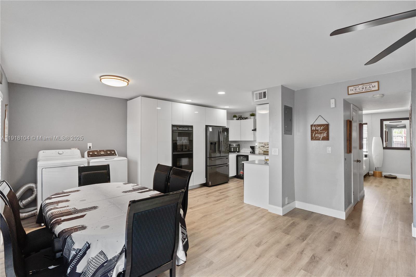 8089 Southwest 18th Court, Unit 27 Davie, FL 33324 - Photo 13 of 36 a kitchen with a refrigerator and a stove top oven