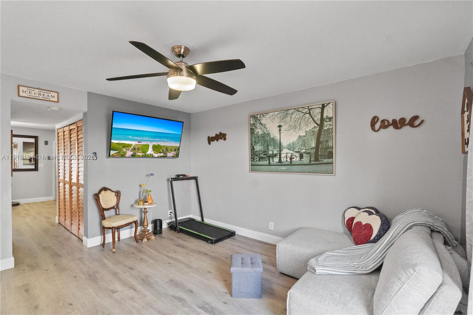 8089 Southwest 18th Court, Unit 27 Davie, FL 33324 - Photo 14 of 36 a living room with furniture and a wooden floor