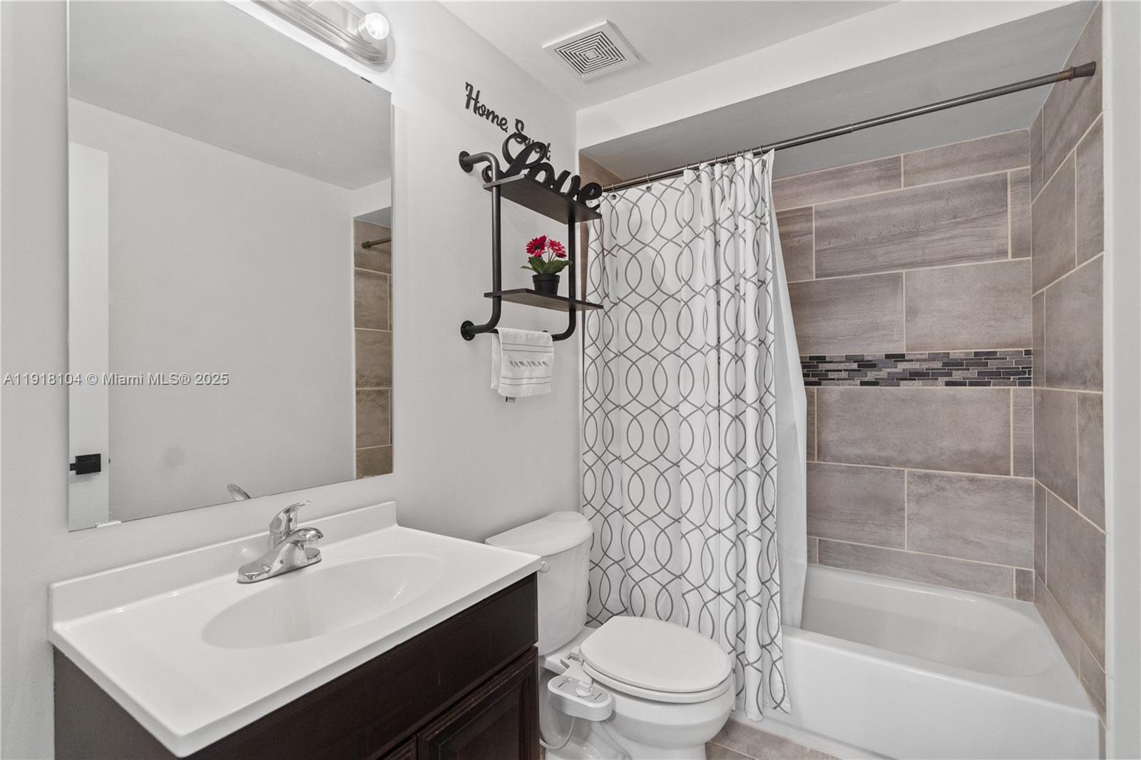 8089 Southwest 18th Court, Unit 27 Davie, FL 33324 - Photo 17 of 36 a bathroom with a sink toilet and shower