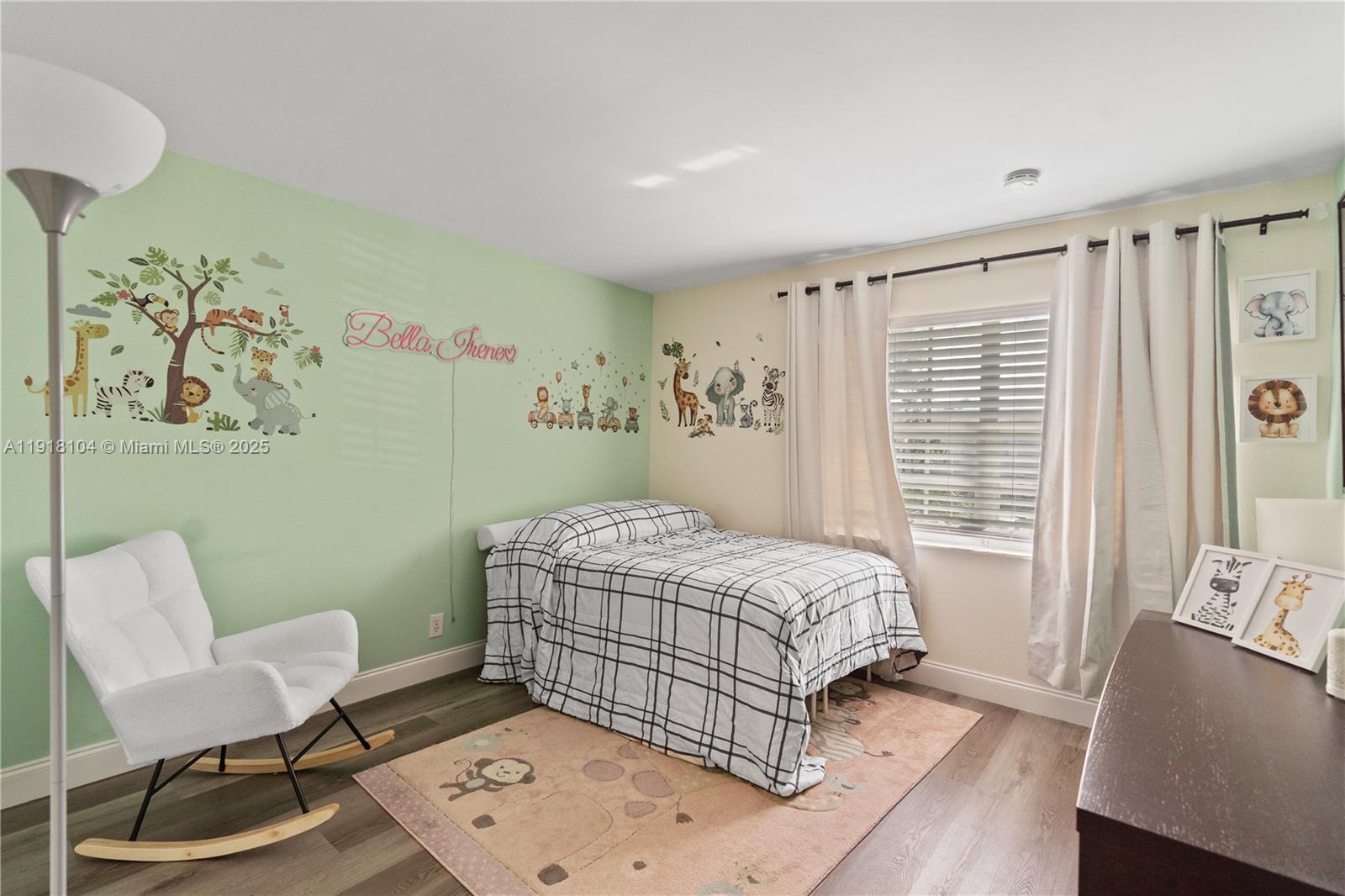 8089 Southwest 18th Court, Unit 27 Davie, FL 33324 - Photo 18 of 36 a bedroom with a bed and a window