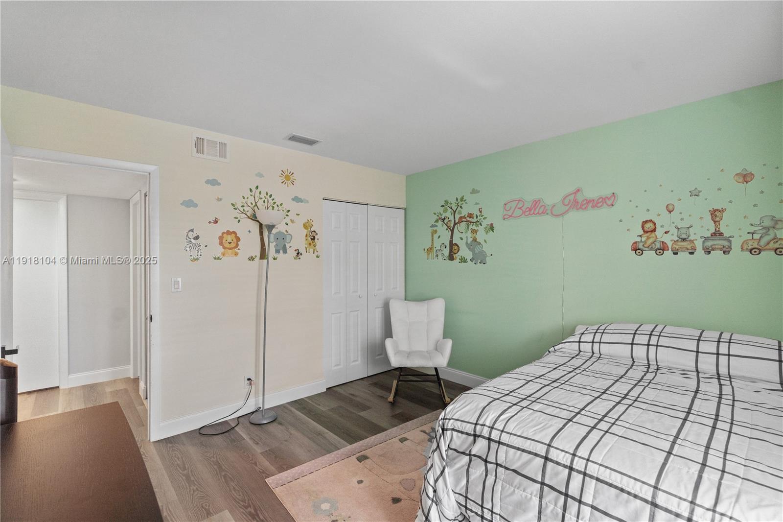 8089 Southwest 18th Court, Unit 27 Davie, FL 33324 - Photo 19 of 36 a bedroom with a bed and a wooden floor