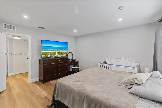 a bedroom with a bed and a dresser