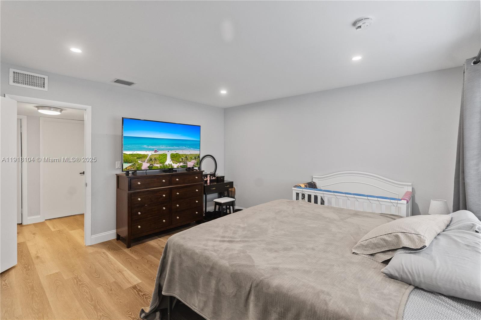 8089 Southwest 18th Court, Unit 27 Davie, FL 33324 - Photo 22 of 36 a bedroom with a bed and a dresser