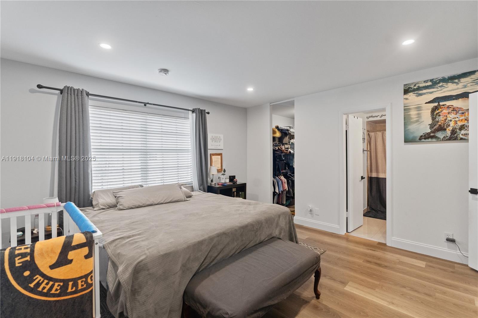 8089 Southwest 18th Court, Unit 27 Davie, FL 33324 - Photo 23 of 36 a bedroom with a bed and a large window