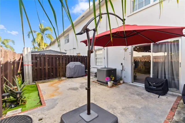 a view of a chairs and table in the patio