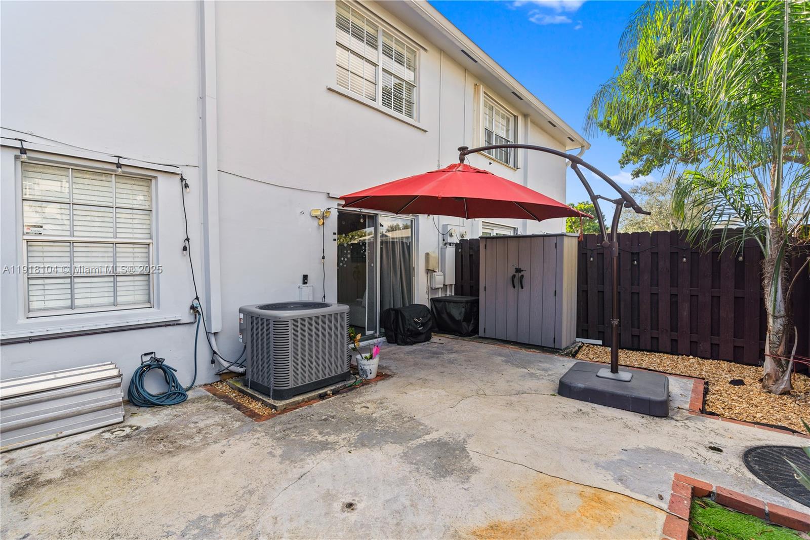8089 Southwest 18th Court, Unit 27 Davie, FL 33324 - Photo 28 of 36 a view of a house with backyard and furniture