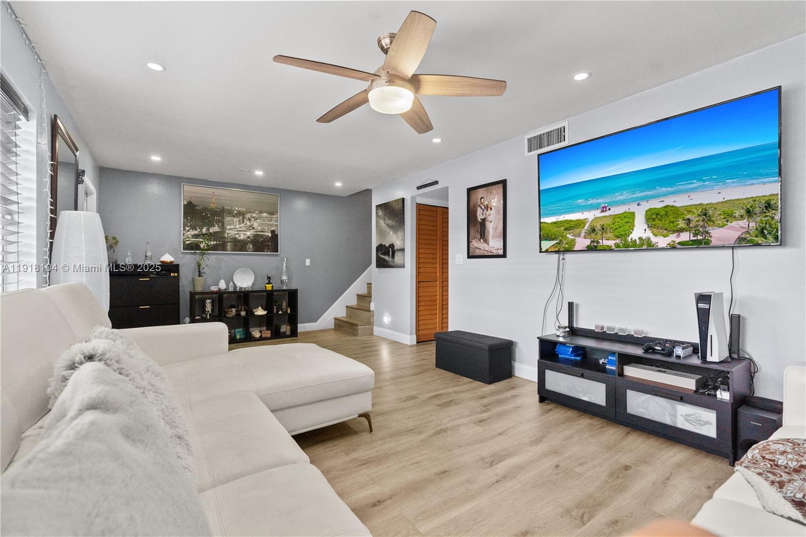 8089 Southwest 18th Court, Unit 27 Davie, FL 33324 - Photo 3 of 36 a living room with furniture and a flat screen tv