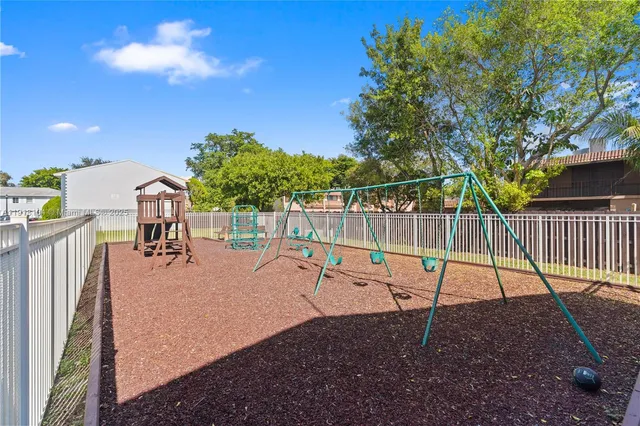 a view of a swimming pool with a slide