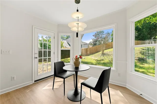 a view of a dining room with furniture window and outside view
