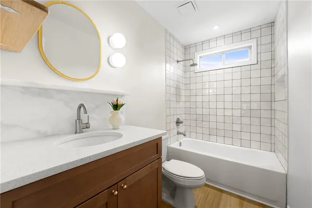 a bathroom with a mirror and a sink