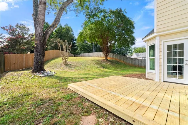 a view of a yard with a tree