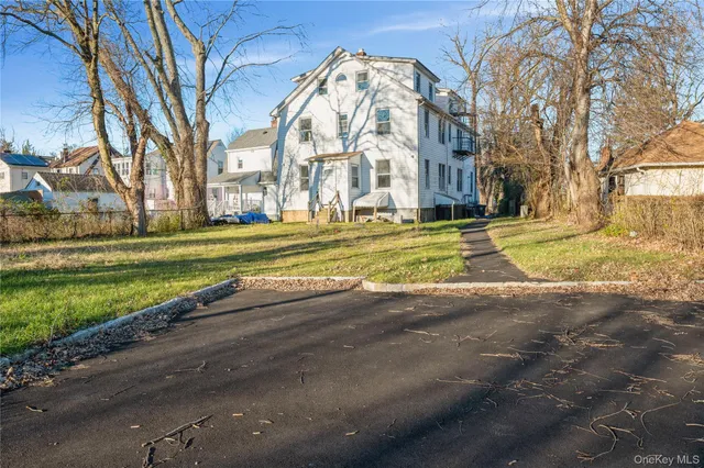 a brick building with trees in front of it