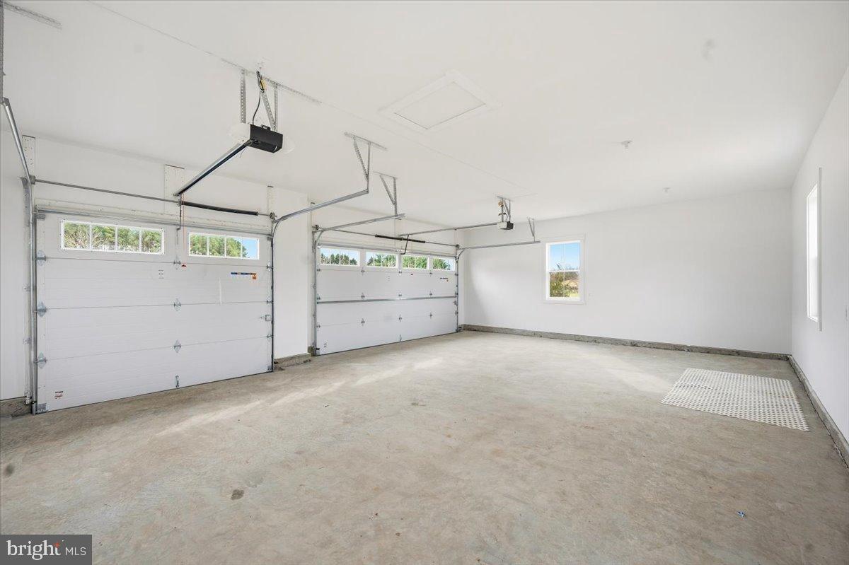 39762 Rivers Edge Lane Lovettsville, VA 20180 - Photo 114 of 118 Spacious 3 car garage with ample natural light.