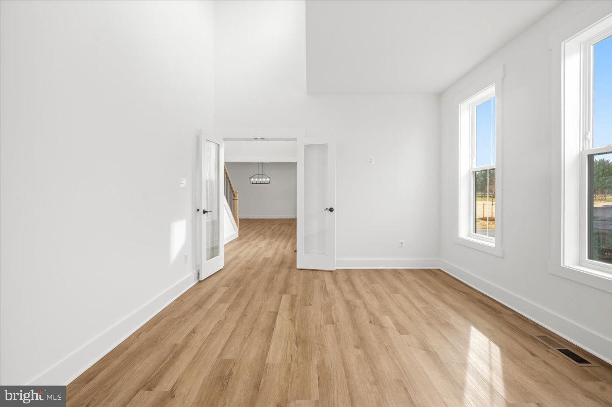 39762 Rivers Edge Lane Lovettsville, VA 20180 - Photo 17 of 118 wooden floor in an empty room with a window