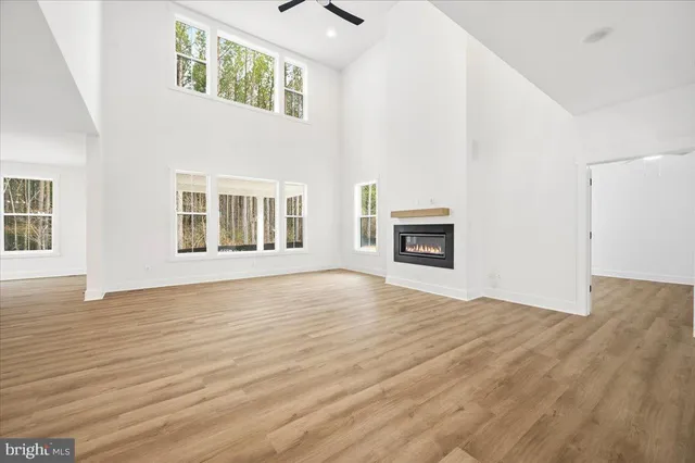 a view of storage and utility room with wooden floor