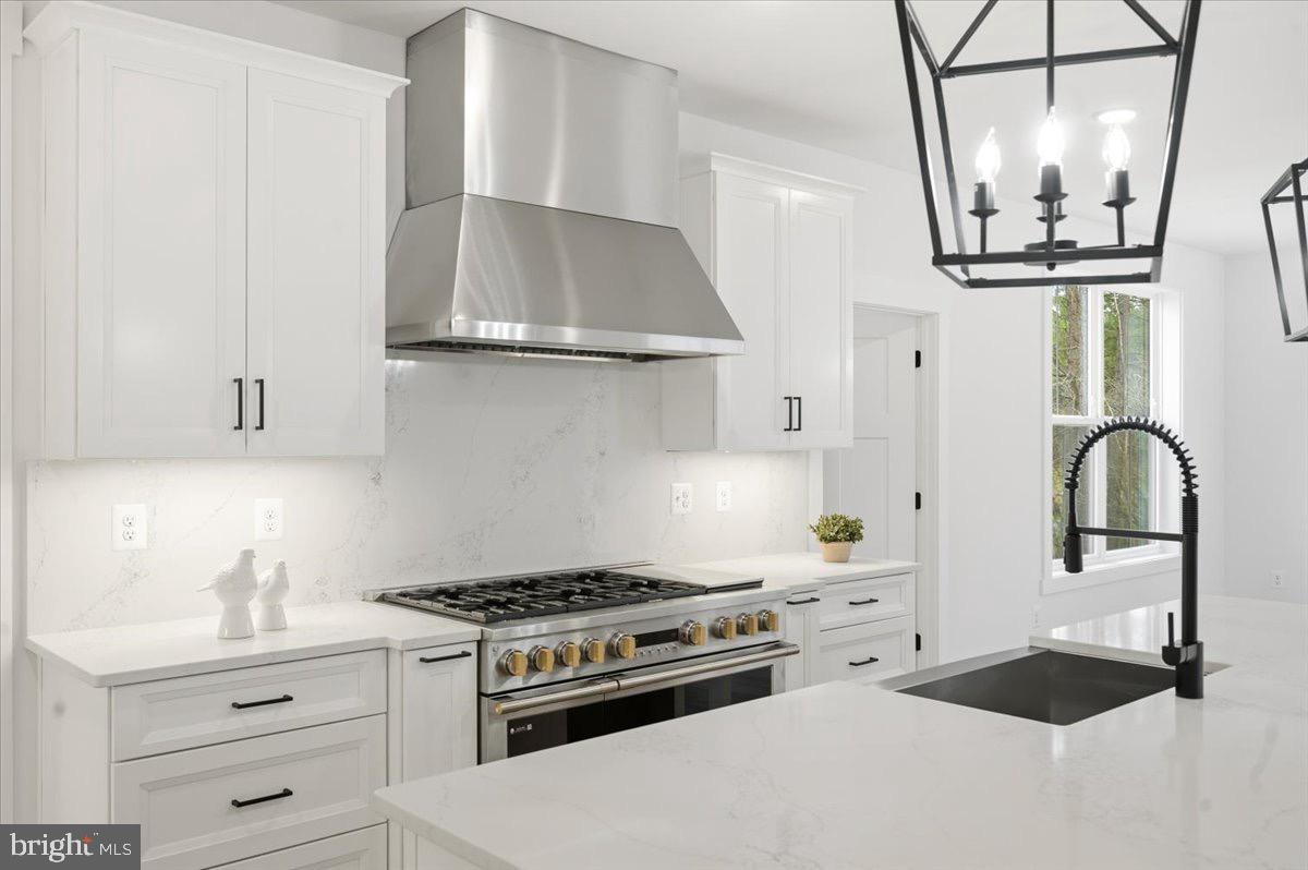 39762 Rivers Edge Lane Lovettsville, VA 20180 - Photo 34 of 118 a kitchen with stainless steel appliances a white stove top oven and sink