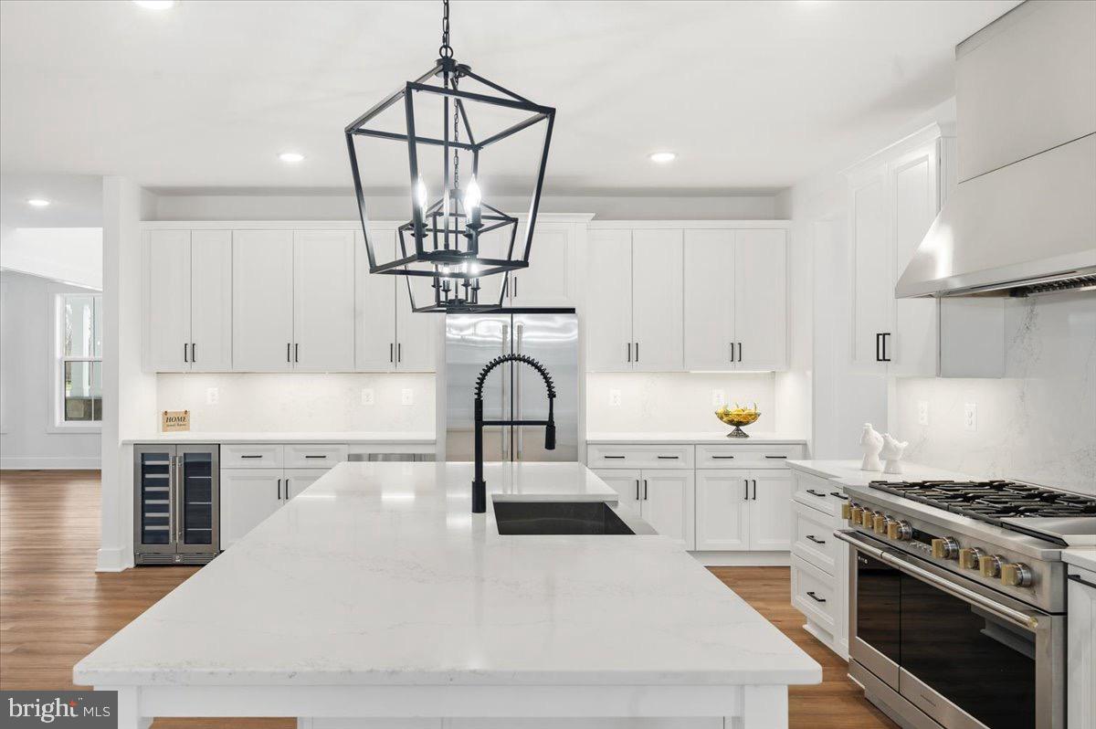 39762 Rivers Edge Lane Lovettsville, VA 20180 - Photo 42 of 118 a kitchen with stainless steel appliances granite countertop a sink a stove and cabinets