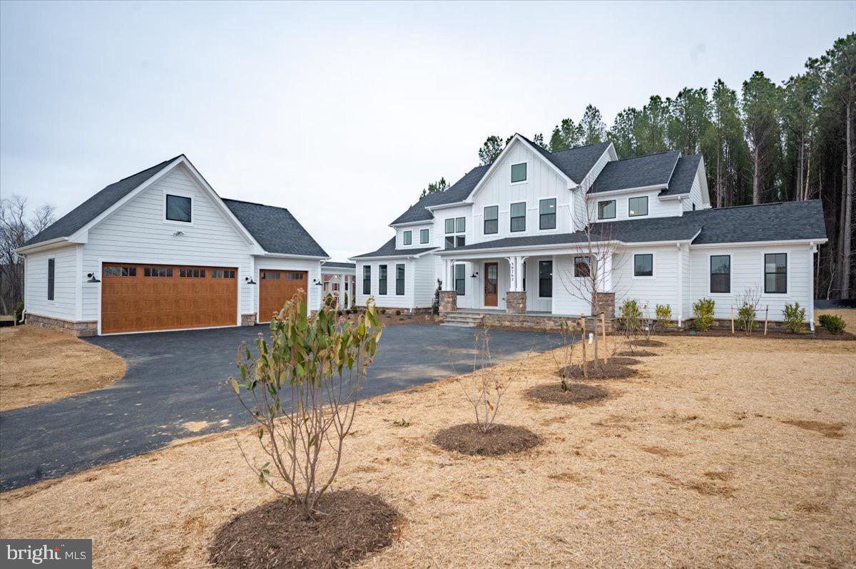 39762 Rivers Edge Lane Lovettsville, VA 20180 - Photo 5 of 118 a front view of a house with a yard covered in snow