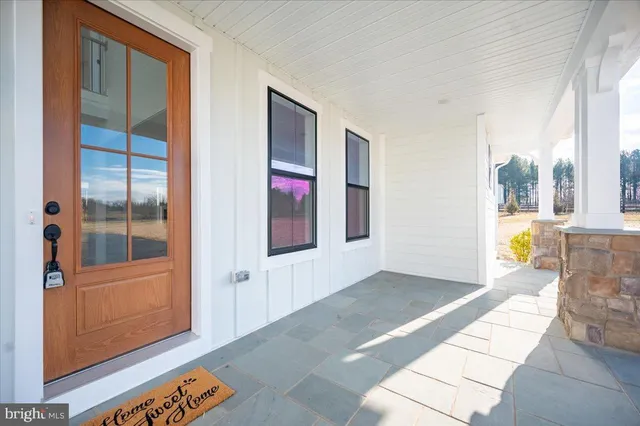 a view of entryway with wooden floor