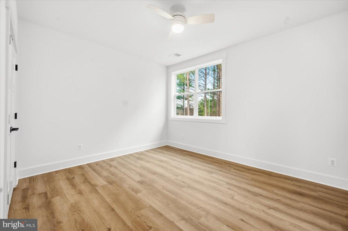 39762 Rivers Edge Lane Lovettsville, VA 20180 - Photo 78 of 118 an empty room with wooden floor and windows