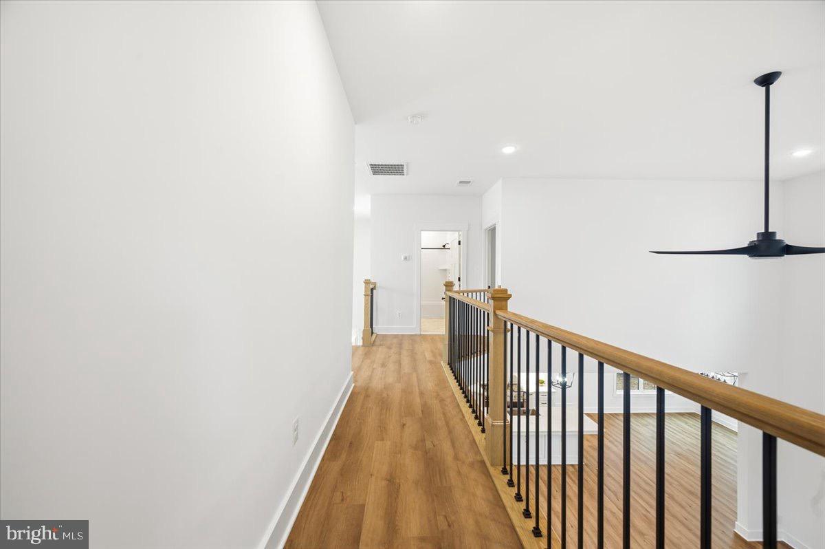 39762 Rivers Edge Lane Lovettsville, VA 20180 - Photo 83 of 118 a view of a hallway with wooden floor