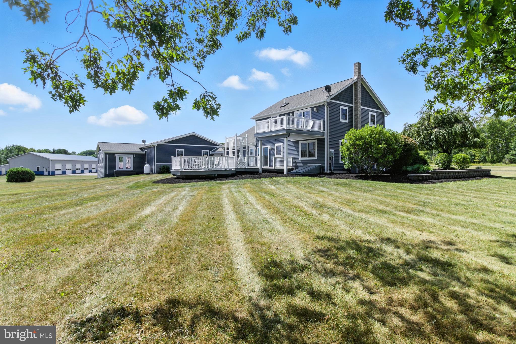 2230 Six Mile Road Philipsburg, PA 16866 - Photo 15 of 70 a view of a house with a big yard and large trees