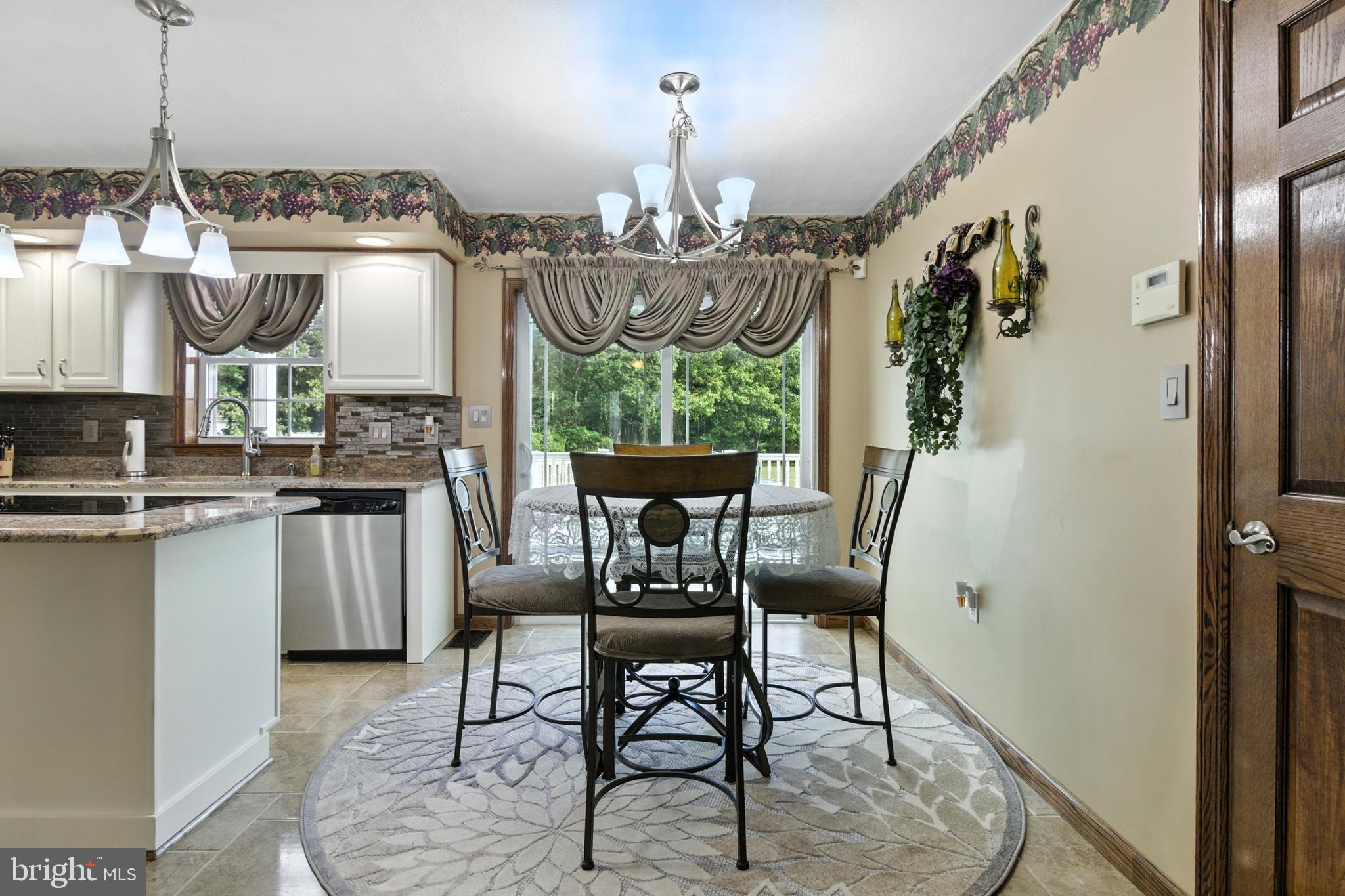 2230 Six Mile Road Philipsburg, PA 16866 - Photo 19 of 70 a view of a dining room with furniture a chandelier and wooden floor