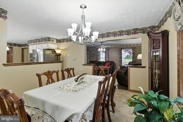 a living room with furniture and flowers