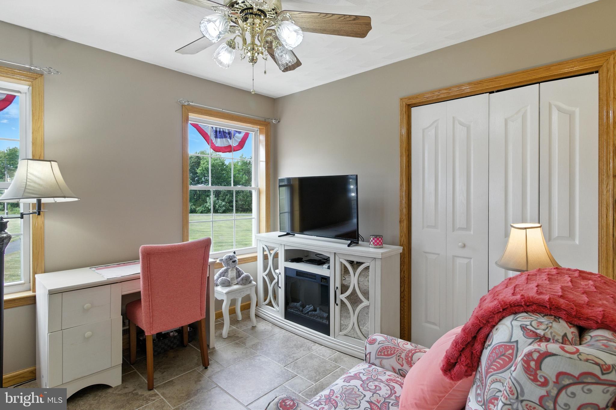 2230 Six Mile Road Philipsburg, PA 16866 - Photo 23 of 70 a bedroom with a bed and a flat screen tv