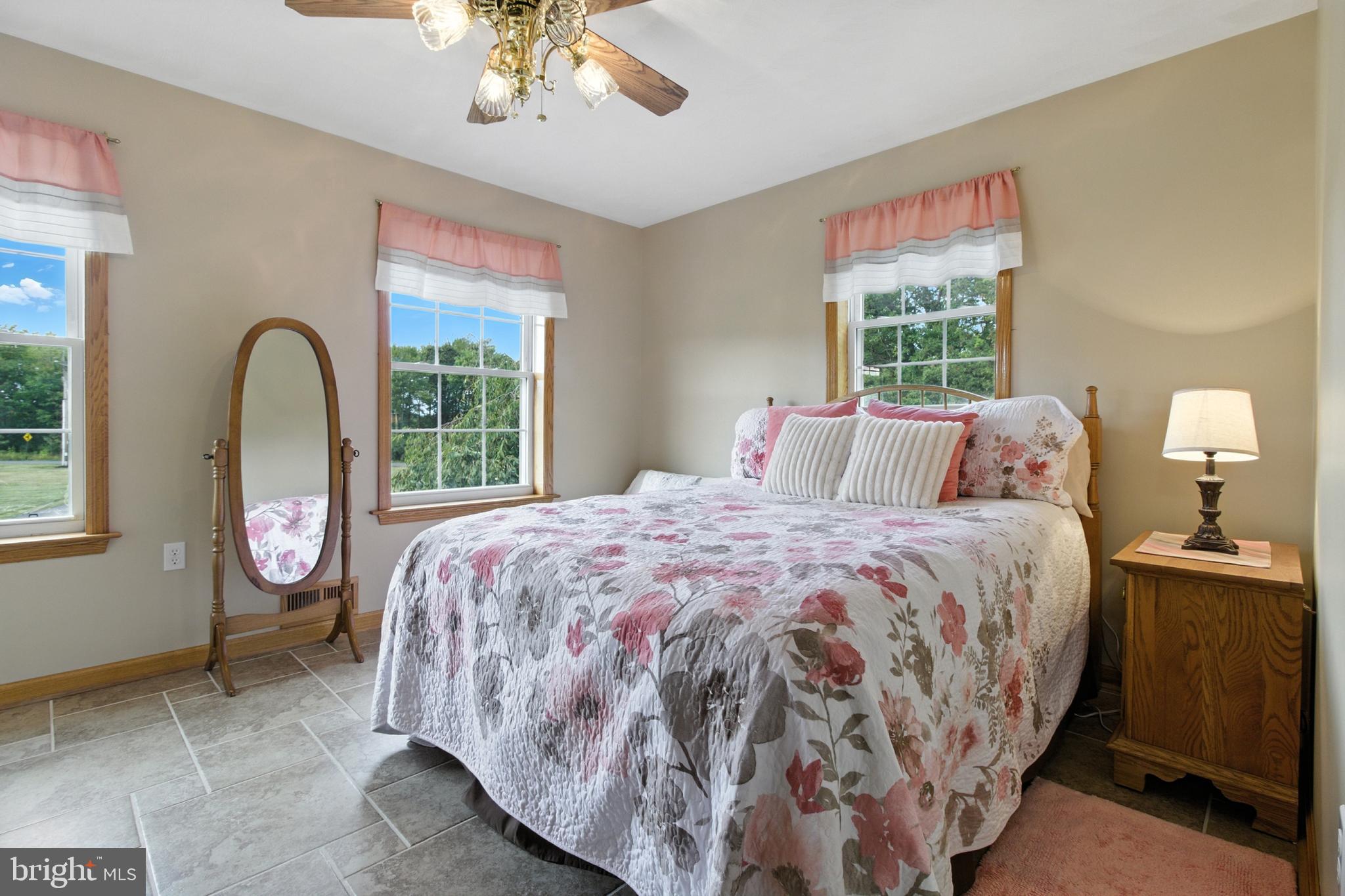 2230 Six Mile Road Philipsburg, PA 16866 - Photo 24 of 70 a bedroom with a large bed and a chandelier