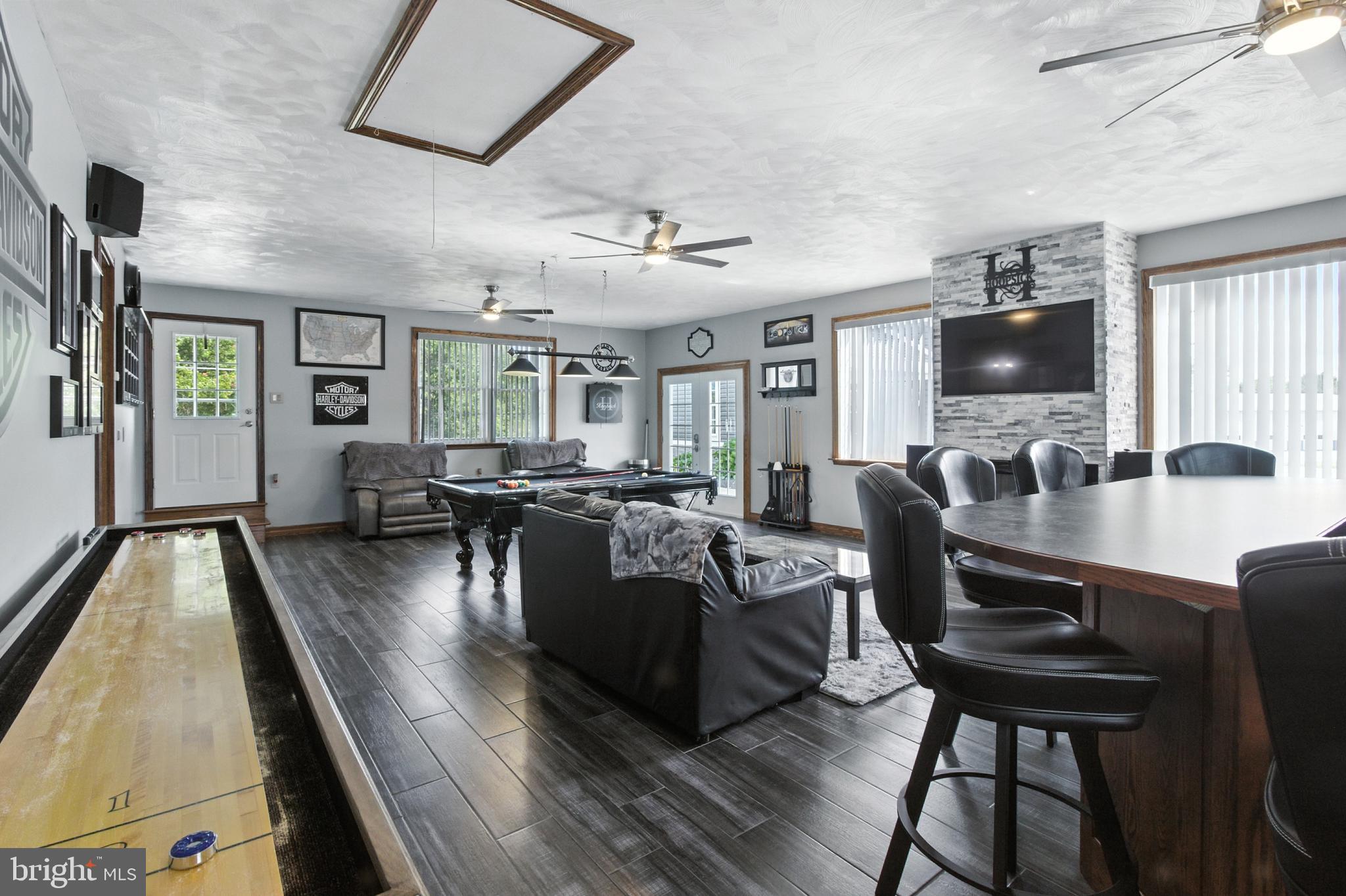 2230 Six Mile Road Philipsburg, PA 16866 - Photo 39 of 70 a living room with furniture and a flat screen tv