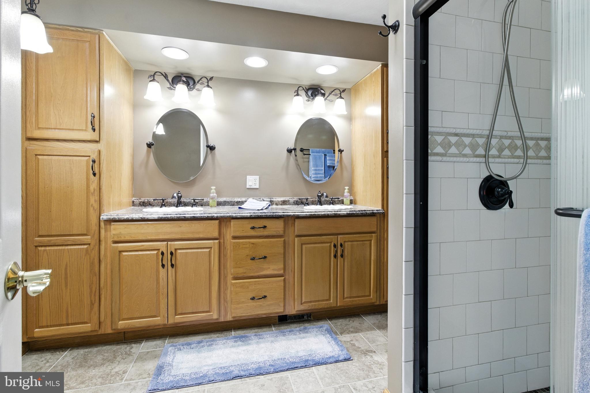 2230 Six Mile Road Philipsburg, PA 16866 - Photo 46 of 70 a bathroom with a granite countertop sink mirror and