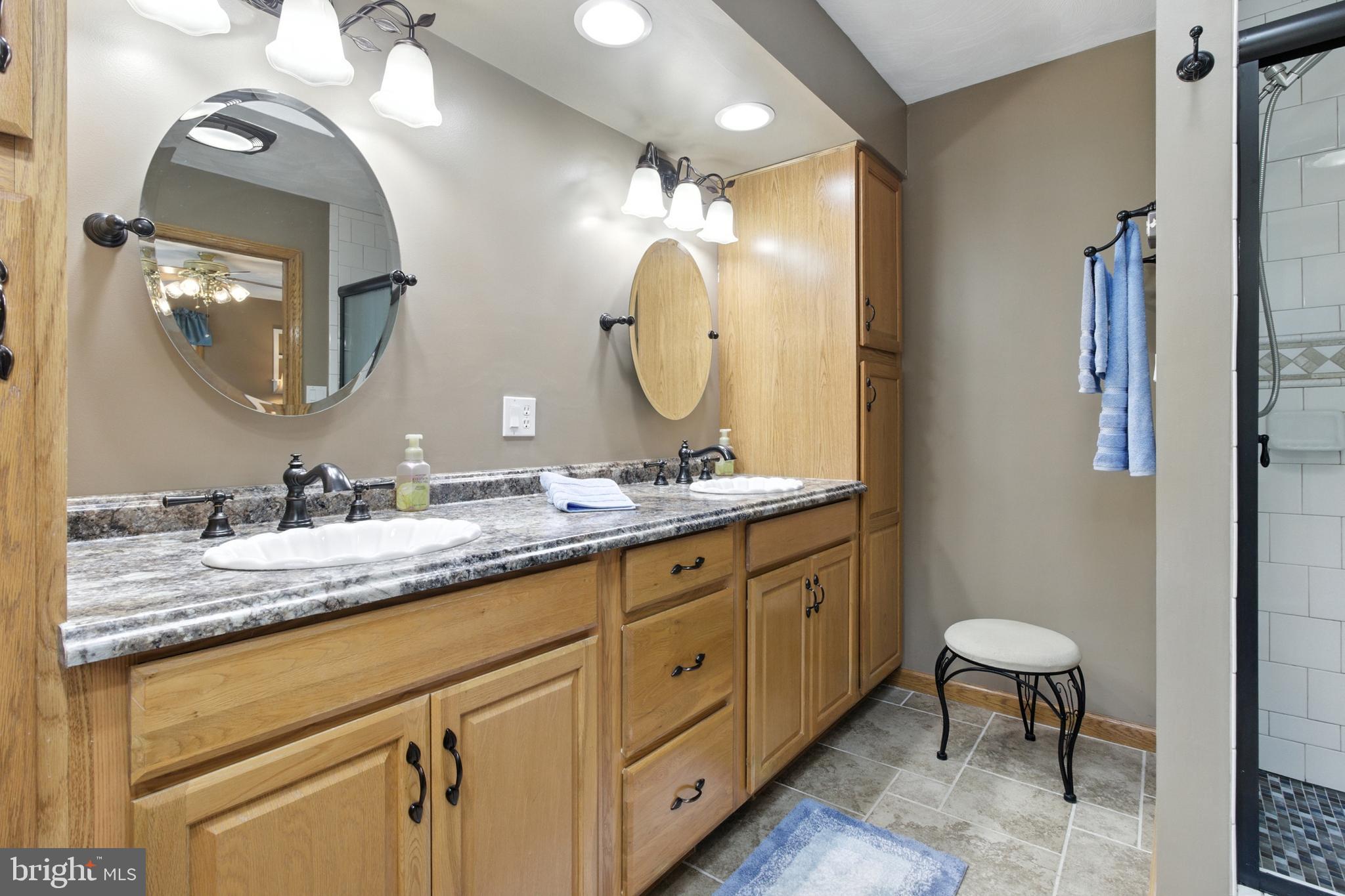2230 Six Mile Road Philipsburg, PA 16866 - Photo 47 of 70 a bathroom with a double vanity sink and a mirror