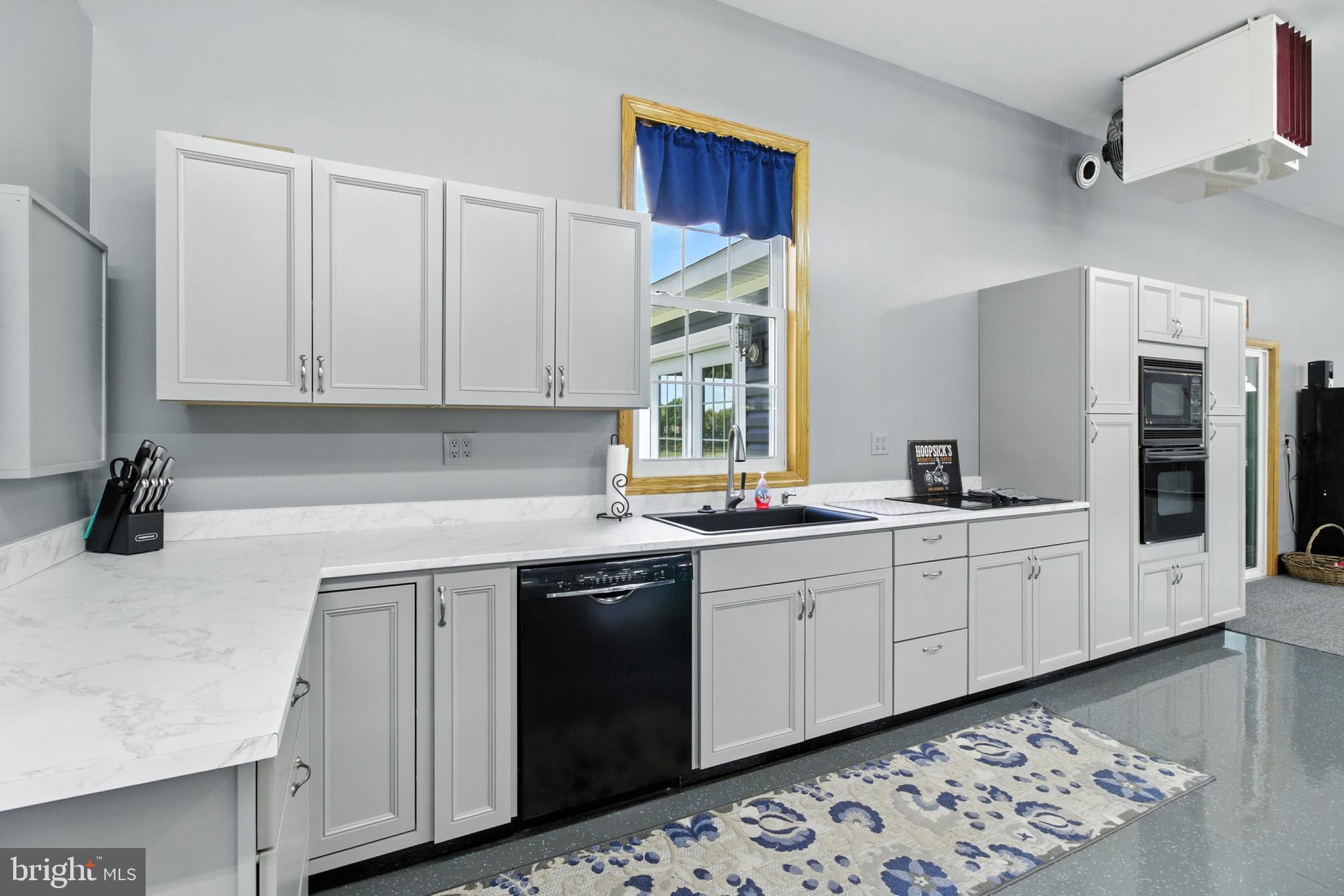 2230 Six Mile Road Philipsburg, PA 16866 - Photo 61 of 70 a kitchen with stainless steel appliances granite countertop a sink and cabinets
