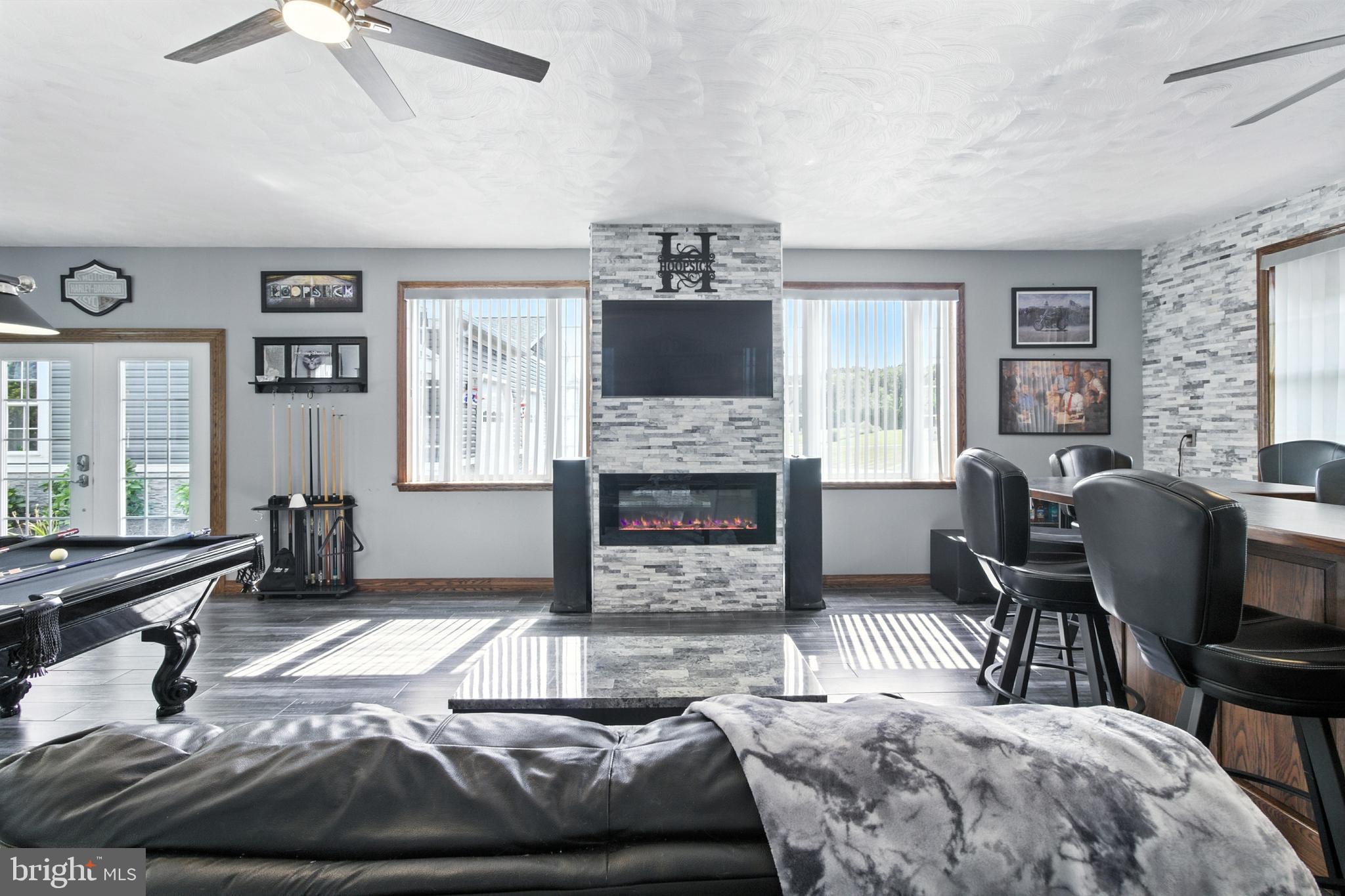 2230 Six Mile Road Philipsburg, PA 16866 - Photo 64 of 70 a living room with furniture and a fireplace