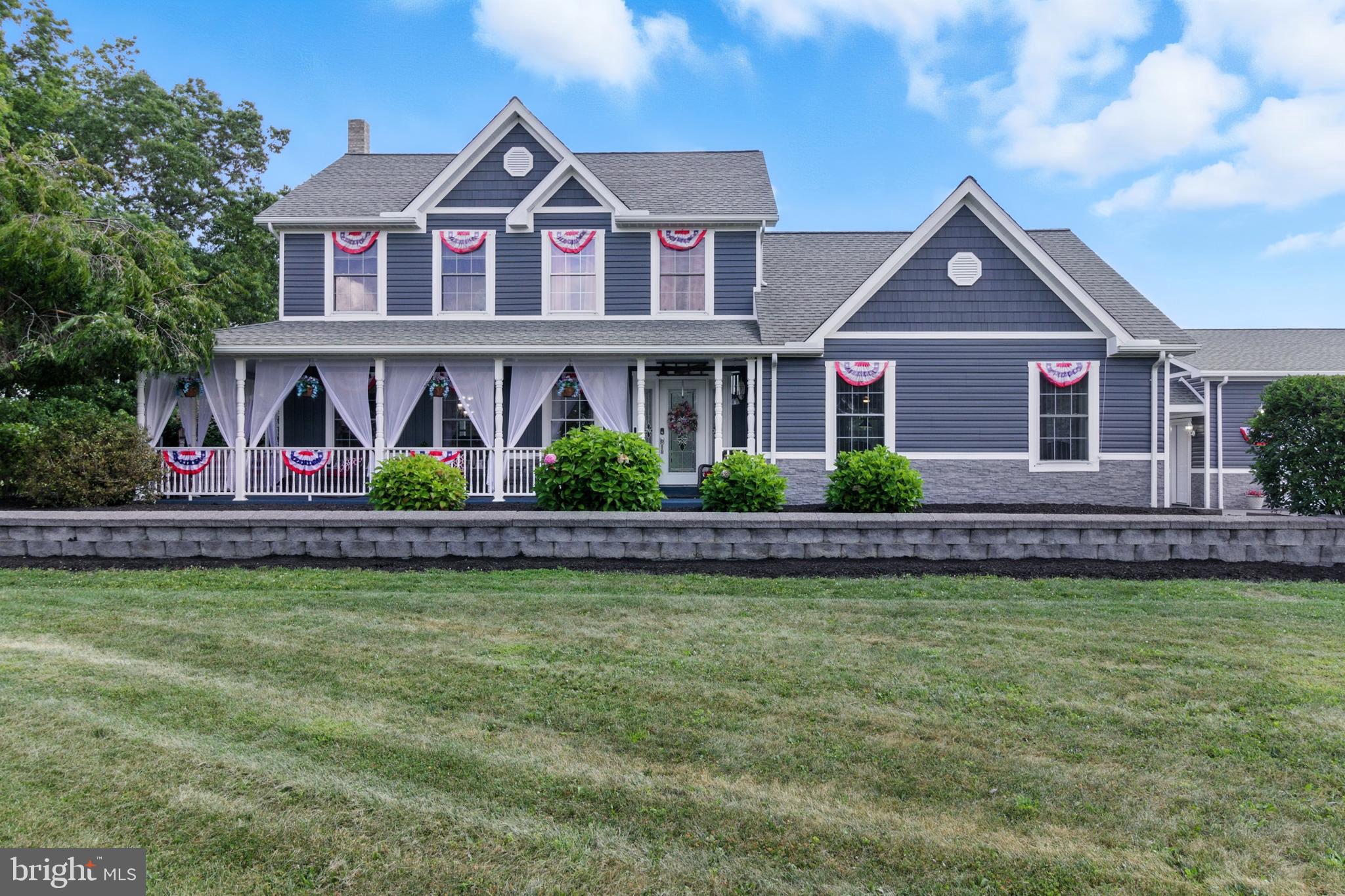 2230 Six Mile Road Philipsburg, PA 16866 - Photo 7 of 70 a front view of a house with swimming pool and glass windows