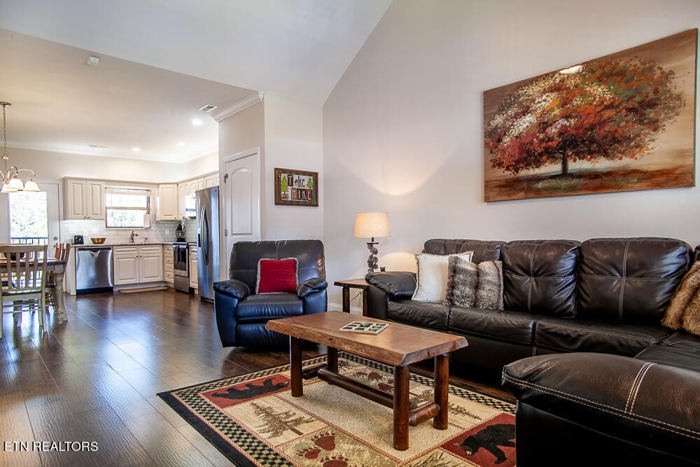338 Shooting Star Loop, Unit 203 Townsend, TN 37882 - Photo 2 of 30 a living room with furniture and a wooden floor