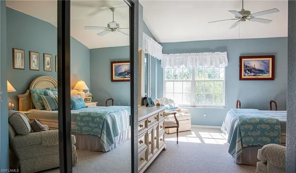 a bedroom with furniture and a window