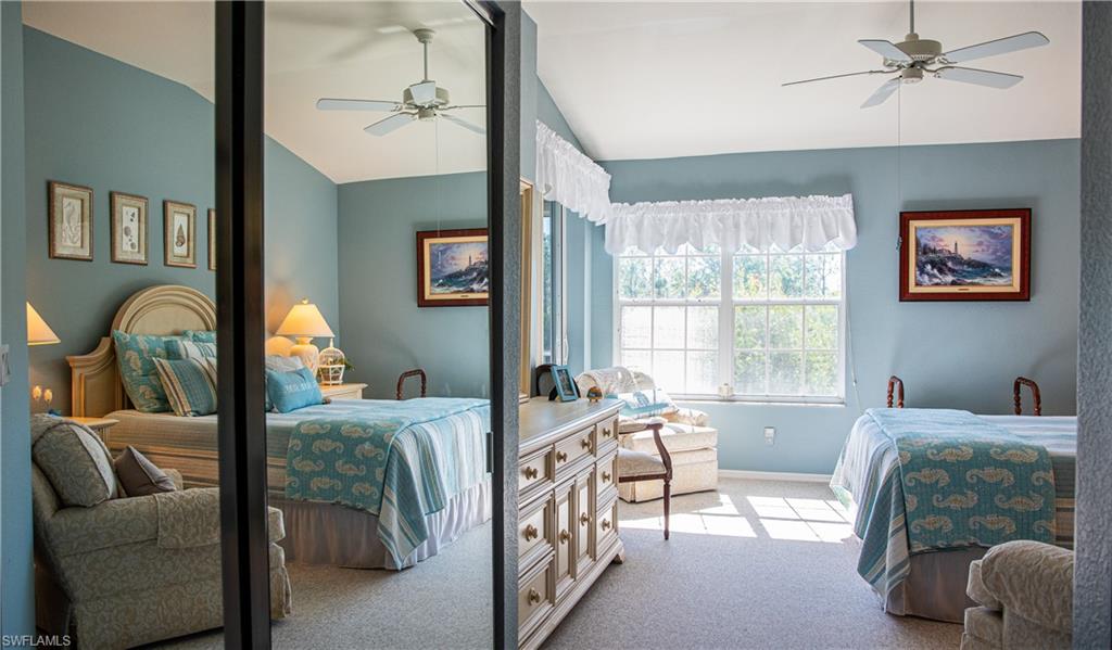 10711 Crooked River Road, Unit 202 Estero, FL 34135 - Photo 16 of 28 a bedroom with furniture and a window