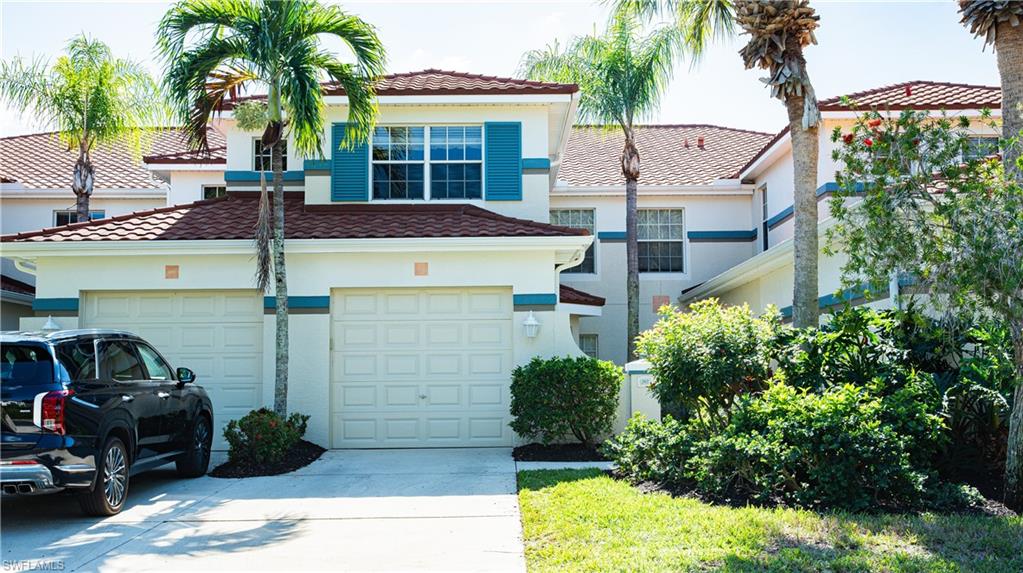 10711 Crooked River Road, Unit 202 Estero, FL 34135 - Photo 24 of 28 a view of a car park in front of house