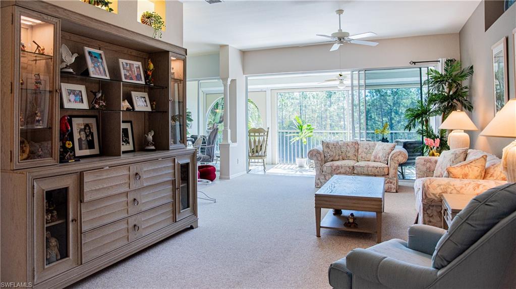 10711 Crooked River Road, Unit 202 Estero, FL 34135 - Photo 6 of 28 a living room with furniture and a large window