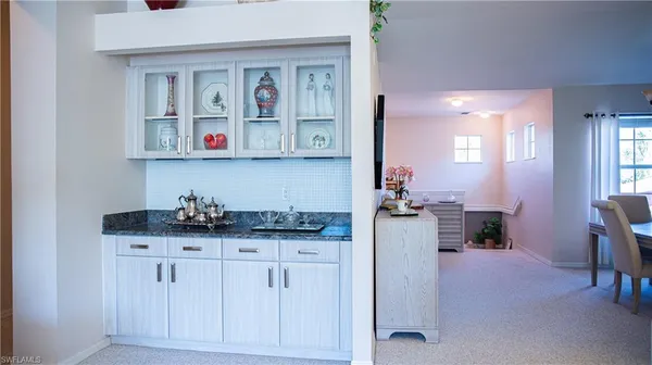 a kitchen with cabinets and window