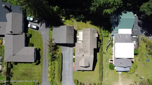 an aerial view of residential houses with outdoor space